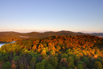 An aerial view of a hot air balloon floating over the Vermont country side ..
