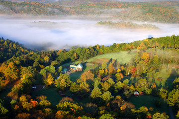 An aerial view of a hot air balloon floating over the Vermont country side ..