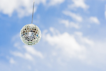 Mirror ball with a background as a beautiful sunny sky.