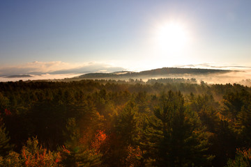 An aerial view of a hot air balloon floating over the Vermont country side ..