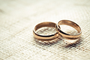 Obraz na płótnie Canvas engagement rings on cloth texture - wedding rings