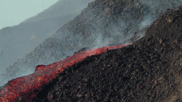 Lava flow from a vent. Mount Etna eruption