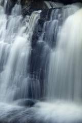 Fototapeta na wymiar Cascading Southford Falls in long exposure, Oxford, Connecticut.