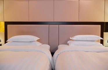 Fototapeta na wymiar two beds in a hotel room