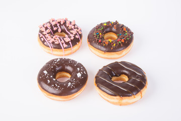 chocolate donuts on a white background