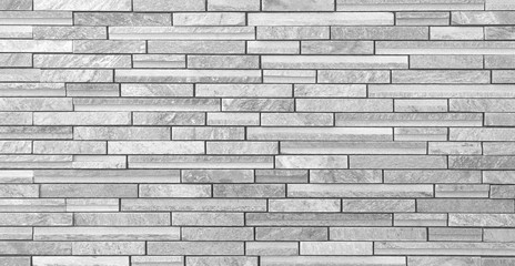 Texture and seamless background of white granite stone block wall..