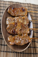 Thai-styled grilled pork. It's among most popular street foods in Thailand.