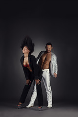 Sexy dancers posing in pair. Studio photo