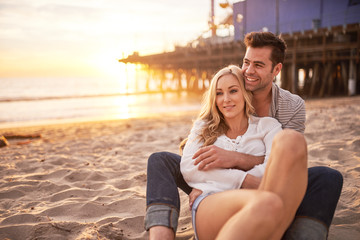 romantic couple having fun at santa monica on beach - Powered by Adobe