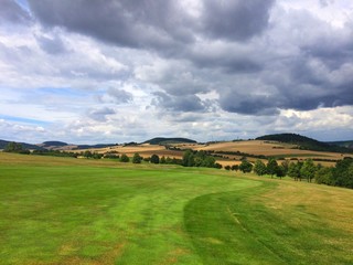 On a empty golf course before storm