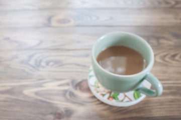 hot coffee cup on wood table