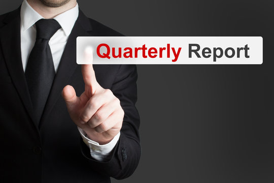 Businessman Pushing Button Quarterly Report