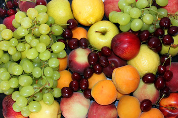 still life of variety of fruits and berries
