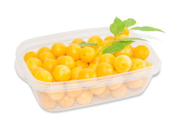 Cherry plum in plastic tray on a light background