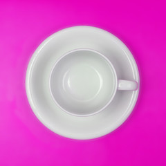 empty white coffee or tea cup on vibrant color background
