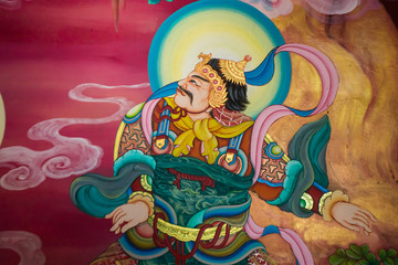 Mural in native thai style painting on the wall of Buddhist chur