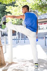  An handsome athlete stretching