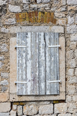 Fototapeta na wymiar Window with louvers in old house