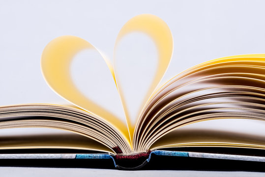 Heart Shaped Book.Book page in heart shape, focus on background.