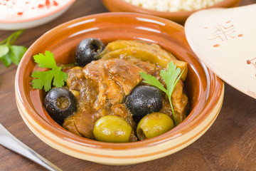 Chicken Tagine - Moroccan chicken tagine with olives, preserved lemon and fennel, served bulgur wheat.
