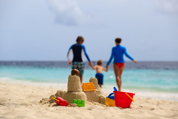 sand castle on tropical beach, family vacation