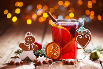 Christmas background with hot wine punch, cookies and smiling ginger bread man :) - obrazy, fototapety, plakaty