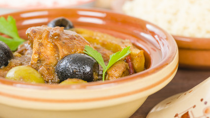 Chicken Tagine - Moroccan chicken tagine with olives, preserved lemon and fennel, served bulgur wheat.
