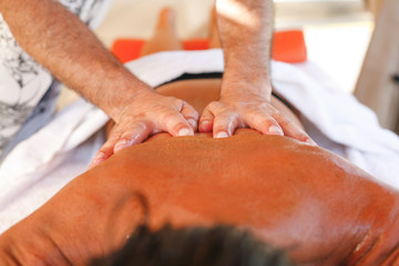Obraz na płótnie Canvas Massage therapist in action