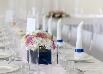 Wedding table with bouquet of gerbera flowers