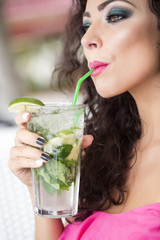 Lady drinking mojito