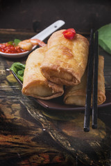 Fried spring rolls with  shrimps, bok choi, chili pepper and hot