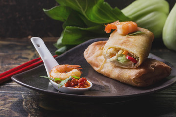 Fried spring rolls with  shrimps, bok choi, chili pepper and hot