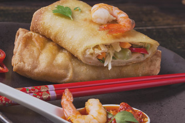 Fried spring rolls with  shrimps, bok choi, chili pepper and hot