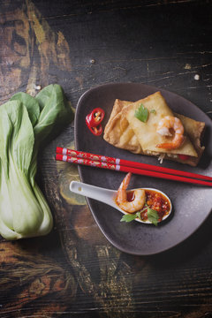 Fried spring rolls with  shrimps, bok choi, chili pepper and hot