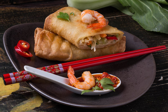 Fried spring rolls with  shrimps, bok choi, chili pepper and hot