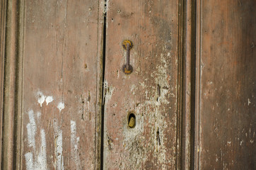 detail Old wooden door with no lock in the old city