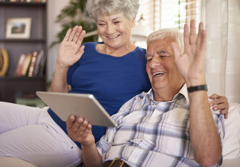 Elder couple having a video conversation