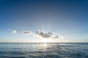 Fototapeta na wymiar Sunset, sunbeam, sky, sea, coast. Okinawa, Japan, Asia.