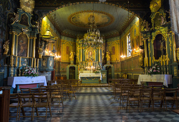 Fototapeta na wymiar PODSTOLICE, CRACOW, POLAND - JUNE 30, 2015: Interior of the wooden antique church in Podstolice near Cracow. Poland