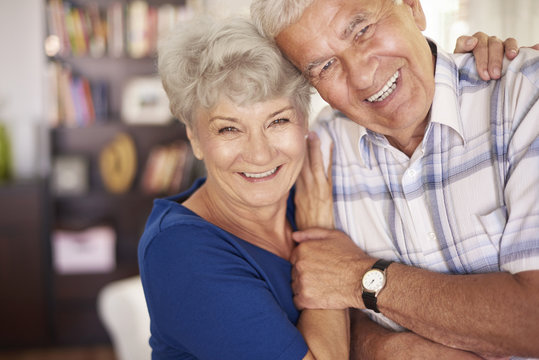 Portrait of happy senior couple in arms