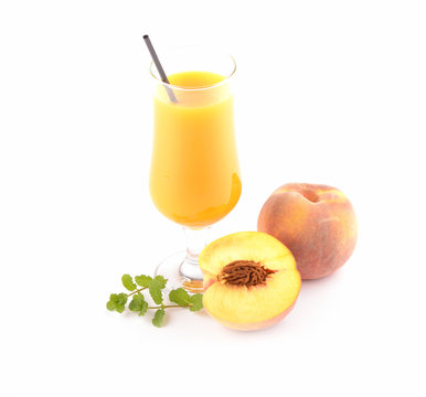 Glass of peach juice isolated on white