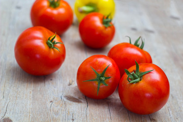 Vegetables tomatoes and pepper on wooden background