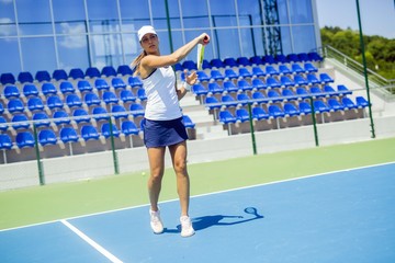Beautiful female tennis player in action