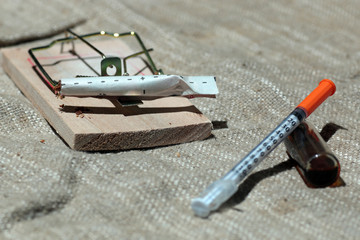 Drugs in a mousetrap cant dose syringe