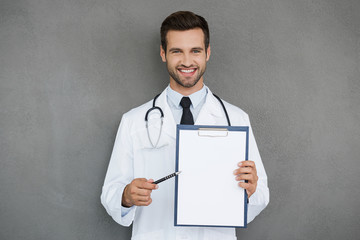 Doctor pointing copy space. 
