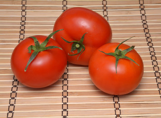 Tomatoes on a natural bamboo table mat