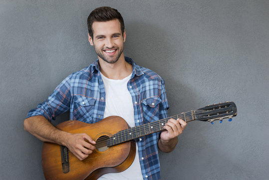 Young man with guitar. 