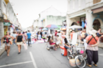 Obraz premium Blurred people walking on the street