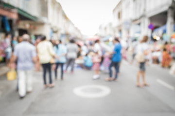 Blurred people walking on the street in phuket old town