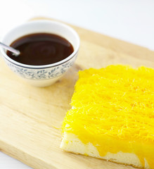 Golden thread (Foythong Cake) and hot coffee on wooden backgroun